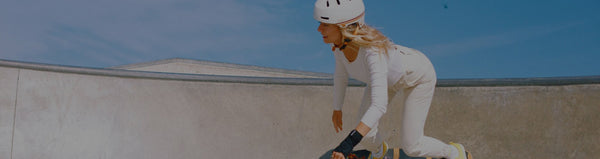 woman skating in a bowl wearing a macon 2.0 helmet